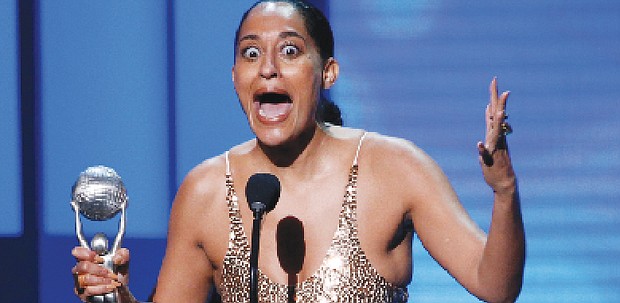 Tracee Ellis Ross, right, reacts to winning the award for Outstanding Actress in a Comedy Series for the popular television show, “black-ish.” 