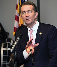 Gov.-elect Ralph S. Northam speaks as retired Judge Birdie Jamison listens at a pre-inaugural reception hosted Jan. 11 at a Downtown hotel by four area NAACP branches. The event was held for the incoming governor, Lt. Gov. Justin E. Fairfax and Attorney General Mark R. Herring to meet members of various African-American organizations and churches that played a significant role in their election on Nov. 7.