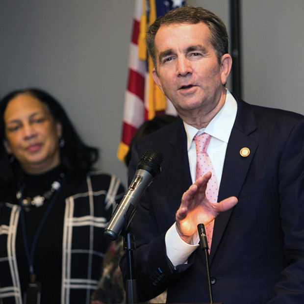 Gov.-elect Ralph S. Northam speaks as retired Judge Birdie Jamison listens at a pre-inaugural reception hosted Jan. 11 at a Downtown hotel by four area NAACP branches. The event was held for the incoming governor, Lt. Gov. Justin E. Fairfax and Attorney General Mark R. Herring to meet members of various African-American organizations and churches that played a significant role in their election on Nov. 7.