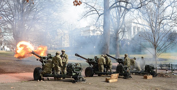 The Virginia National Guard fires a 21-gun salute after Gov. Ralph S. Northam takes the oath of office, another Virginia tradition.
