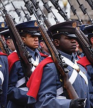 Cadets from Virginia Military Institute, Gov. Ralph S. Northam’s alma mater, lead the parade following a Black Hawk helicopter flyover by the Virginia National Guard.