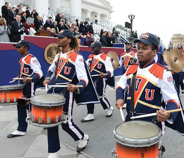 The Virginia State University Trojan Explosion Marching Band carries the beat during the 25-unit inaugural parade.