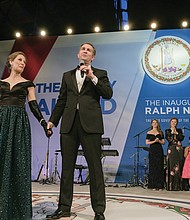 With his wife, Pam Northam, at his side, Gov. Ralph S. Northam addresses the crowd at the inaugural ball Saturday night before leading his wife in a dance around the floor. Behind him are, at left, Attorney General Mark R. Herring and his wife, Laura, and, at right, Lt. Gov. Justin E. Fairfax and his wife, Cerina.