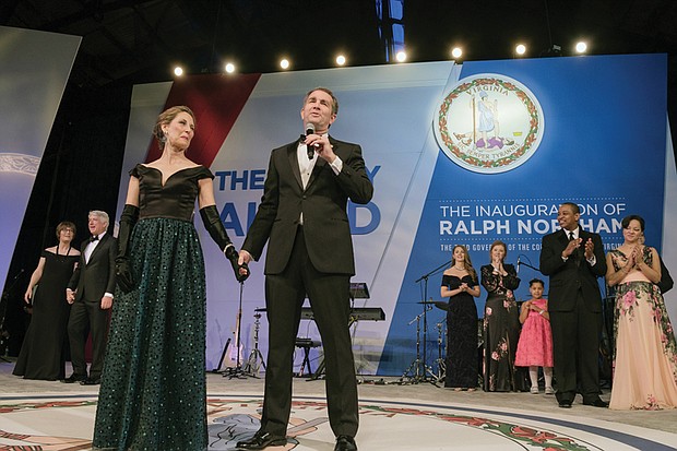 With his wife, Pam Northam, at his side, Gov. Ralph S. Northam addresses the crowd at the inaugural ball Saturday night before leading his wife in a dance around the floor. Behind him are, at left, Attorney General Mark R. Herring and his wife, Laura, and, at right, Lt. Gov. Justin E. Fairfax and his wife, Cerina.