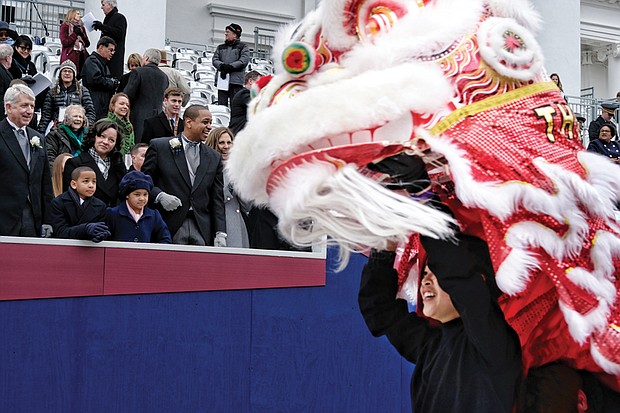 The Pride Chinese Lion Dancers from the University of Virginia in Charlottesville perform a Dragon Dance during the parade.