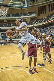 Virginia State University’s Cyonte Melvin takes it to the hoop at the Freedom Classic Festival game Sunday against rival Virginia Union University at the Richmond Coliseum.
