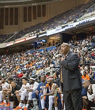 Virginia State University Coach Lonnie Blow anxiously watches the play on the court after Virginia Union University pulled within striking range in the closing minutes of Sunday’s game.