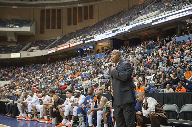 Virginia State University Coach Lonnie Blow anxiously watches the play on the court after Virginia Union University pulled within striking range in the closing minutes of Sunday’s game.