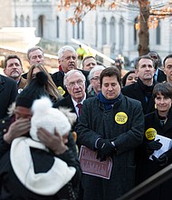 Dueling gun rallies //
Kaaleah Jones, front left, whose father was shot and killed in Newport News, gets a hug after speaking at a vigil and rally Monday in Capitol Square urging tougher state laws to curb gun violence. 
Gov. Ralph S. Northam, seen at right among the crowd, also spoke at the rally sponsored by the Virginia Center for Public Safety. Many state lawmakers attended the afternoon event that called for universal background checks before all gun purchases.
Gov. Northam and others pledged to continue their support for such laws despite the fact that measure and 19 other gun control proposals were killed just hours earlier by a Senate committee.
Earlier on Monday, Congressman Dave Brat and fellow Republican state lawmakers attended a rally at the Bell Tower in support of gun rights and their expansion. That rally was sponsored by the Virginia Citizens Defense League, a pro-gun rights group that describes itself as “more radical than the National Rifle Association.”
