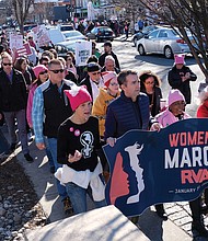 Gov. Ralph S. Northam, second from left, holds the banner with organizers at last Saturday’s Women’s March RVA in Carytown. More than 3,000 marchers turned out for the demonstration.