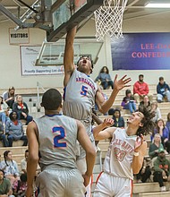 Dominique Finney, a 6-foot-5 junior at Armstrong High School, goes up for a basket at Tuesday night’s game against Hanover County’s Lee-Davis High School.