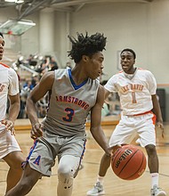 Antoine Bruce, a high-scoring starter for the Armstrong Wildcats, looks for a way around the Lee-Davis defense.