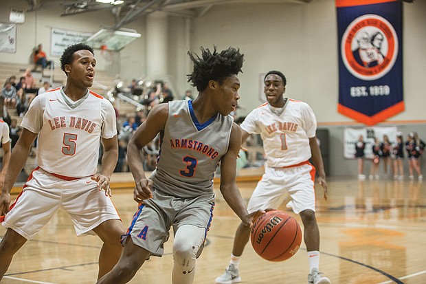 Antoine Bruce, a high-scoring starter for the Armstrong Wildcats, looks for a way around the Lee-Davis defense.