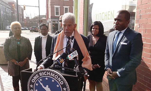 Former state Sen. Henry L. Marsh III, who attended George Mason Elementary School in the 1940s and became Richmond’s first African-American mayor in 1977, speaks in support of Mayor Levar M. Stoney’s plan to increase the city’s meals tax to upgrade city school buildings. With him at the Tuesday news conference in Shockoe Bottom are, from left, Interim 7th District School Board member Cheryl Burke; 7th District City Councilwoman Cynthia I. Newbille; his daughter, Nadine Marsh-Carter, a former Richmond School Board member; Southern Kitchen restaurant owner Shane Thomas; and Mayor Stoney. 
