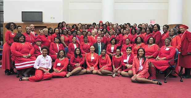 Delta Day at the General Assembly //
Members of Delta Sigma Theta Sorority smile for the camera Monday with Gov. Ralph S. Northam during the annual “Delta Day at the General Assembly.” Wearing the sorority’s signature colors of red and white, sorors from chapters across the state spent the day lobbying state legislators on issues impacting Virginians, including access to health care, voting rights, tougher gun laws, support for education and transportation and environmental issues.