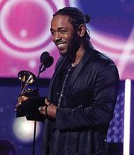 Below, Kendrick Lamar accepts the Grammy for best rap album for “DAMN.”