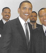 This 2005 photo shows U.S. Sen. Barack Obama with Minister Louis Farrakhan during a Congressional Black Caucus meeting.