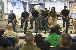 GULF OF ADEN (Feb. 23, 2017) Sailors and a Marine perform a step dance during the African American and Black History Month celebration aboard the amphibious assault ship USS Makin Island (LHD 8). The ship is deployed in the U.S. 5th Fleet area of operations in support of maritime security operations designed to reassure allies and partners, and preserve the freedom of navigation and the free flow of commerce in the region. (U.S. Navy photo by Mass Communication Specialist 3rd Class Devin M. Langer)