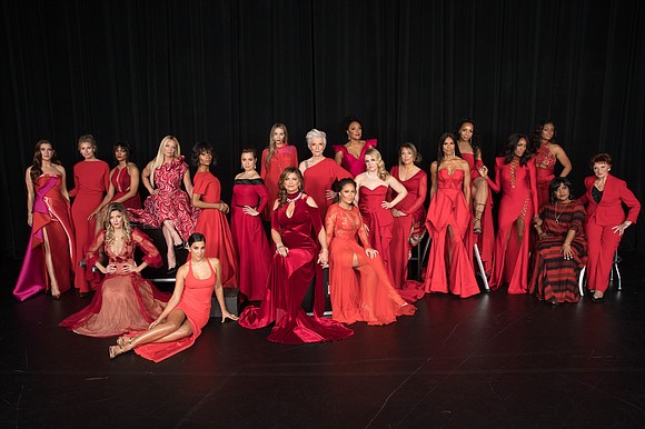 Red dresses, heart signs and dance steps all traveled down the runway Thursday night as celebrity models showed their support …