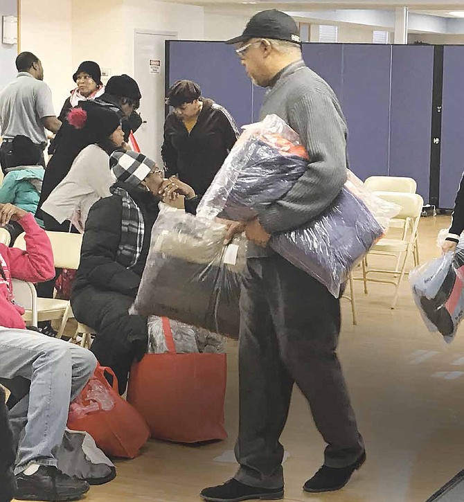 Thornton Township recently held their first winter goat give away at the Town Hall in South Holland. The
event was for residents of Thornton Township and offered 400 brand new coats for children and adults at no cost. Photo Credit: Katherine Newman