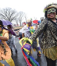 Mardi Gras style // Dogtown Dance Theatre in South Side gets the fun going during the 7th Annual Mardi Gras RVA celebration last Saturday. Members of Claves Unidos dance group kicked off the festivities with a Mardi Gras parade along five blocks in Manchester. Bringing the New Orleans style are, from left, Shalandis Wheeler Smith, Carolyn Jackson and Christina Irby. 
