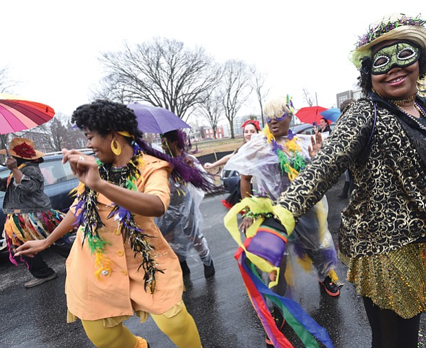 Mardi Gras style // Dogtown Dance Theatre in South Side gets the fun going during the 7th Annual Mardi Gras RVA celebration last Saturday. Members of Claves Unidos dance group kicked off the festivities with a Mardi Gras parade along five blocks in Manchester. Bringing the New Orleans style are, from left, Shalandis Wheeler Smith, Carolyn Jackson and Christina Irby. 
