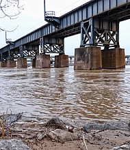 A swollen James River flows by the railroad bridge near Brown’s Island. Fueled by recent heavy rains upstream, the river rose above flood stage running through Richmond. Data show the river crested at 15.4 feet Monday at the Westham gauge, or about 3 feet above flood stage. A kayaker who got stuck Monday in the rapids nearly drowned before he was rescued by city emergency personnel. On Tuesday, when this photo was taken, the river was still running above 11 feet at the City Locks near Shockoe Bottom, also 3 feet above flood stage. The river fell below flood stage Wednesday. The U.S. Weather Service and the U.S. Geological Survey are forecasting that the river will drop to a less treacherous 7 feet by Friday.   