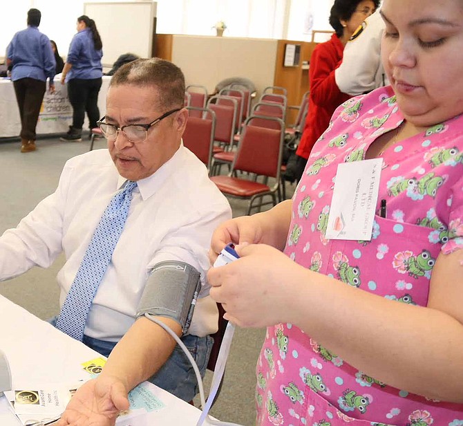 Village of Dolton Mayor, Riley Rogers (pictured) got his blood pressure checked at the recent Community Wellness Day in Dolton where residents received free health screenings, one-on-one pharmacy consultations, and participated in wellness activities. Photo Credit: Edward Steave/Village of Dolton