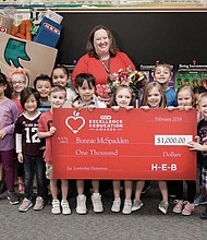 Katy ISD's Bonnie McSpadden was surprised by H-E-B