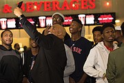 Richmond City Councilman Michael J. Jones takes a selfie with students who accepted his challenge to perform a kind act for others and then received free tickets to last Thursday’s premiere of “Black Panther” at Bow Tie Movieland in Richmond.