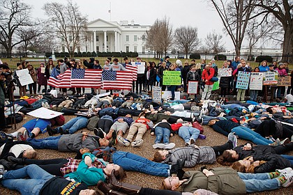 Student demonstrators stage a lie-in Monday outside the White House in Washington seeking tougher gun control laws. 