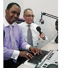 Altony “Tiger” Foote Jr., left, and his father, the Rev. Altony Foote Sr., pose in the WQCN radio studio inside Faith & Love Fellowship Church in South Side. The gospel station reaches listeners over 105.3 FM and streaming on the internet.  