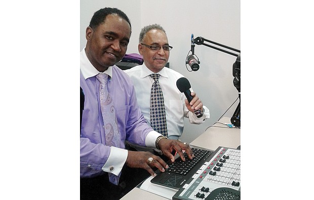 Altony “Tiger” Foote Jr., left, and his father, the Rev. Altony Foote Sr., pose in the WQCN radio studio inside Faith & Love Fellowship Church in South Side. The gospel station reaches listeners over 105.3 FM and streaming on the internet.  