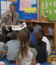 The joy of reading // Theodore Mosley reads to first-graders at Bellevue Elementary in Church Hill last Friday. Mr. Mosley was part of the 100 Men Read project of Mt. Gilead Full Gospel International Ministries. Sheriff Irving was taking part in the annual Read Across America effort to read to children in schools and day care centers. The National Education Association sponsors the effort to promote reading and honor the late noted children’s author Dr. Seuss. Additional volunteers will read to children in Richmond Public Schools and other area schools and programs on Friday, March 2, the birthday of Dr. Seuss, the pen name of Theodor S. Geisel.   
