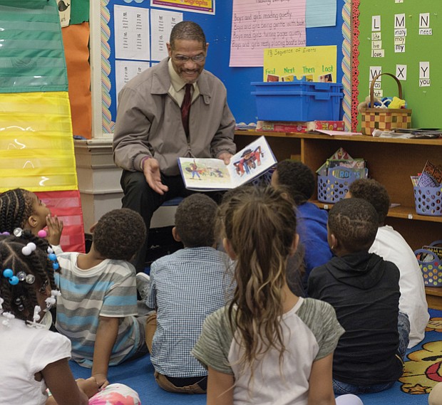 The joy of reading // Theodore Mosley reads to first-graders at Bellevue Elementary in Church Hill last Friday. Mr. Mosley was part of the 100 Men Read project of Mt. Gilead Full Gospel International Ministries. Sheriff Irving was taking part in the annual Read Across America effort to read to children in schools and day care centers. The National Education Association sponsors the effort to promote reading and honor the late noted children’s author Dr. Seuss. Additional volunteers will read to children in Richmond Public Schools and other area schools and programs on Friday, March 2, the birthday of Dr. Seuss, the pen name of Theodor S. Geisel.   