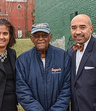Neverett A. Eggleston Jr., center, who helped found the Metropolitan Business League in 1968, stands with Carla P. Childs and Gary L. Flowers on the site of the organization’s original home on 2nd Street near Jackson Street in Jackson Ward. 