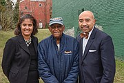 Neverett A. Eggleston Jr., center, who helped found the Metropolitan Business League in 1968, stands with Carla P. Childs and Gary L. Flowers on the site of the organization’s original home on 2nd Street near Jackson Street in Jackson Ward. 