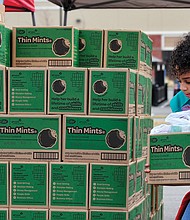 Scout Sahmeah Jamison, right, carefully balances a box to complete another order. Cookie sales will continue around the Richmond area through   late March.
