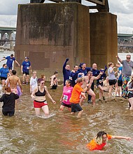Cityscape // people get wet during the annual “Shiver in the River” winter festival Saturday in Downtown near Historic Tredegar. 