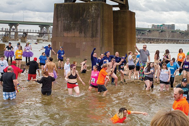 Cityscape // people get wet during the annual “Shiver in the River” winter festival Saturday in Downtown near Historic Tredegar. 