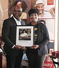 Wells Fargo Region Bank President presents small business owner Orgena Keener with token of appreciation for her service to the community.