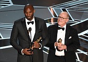Retired NBA star Kobe Bryant, left, and Disney animator Glen Keane accept Oscars for best animated short for “Dear Basketball” at Sunday’s awards show. Social media blew up, citing an irony in Mr. Bryant’s winning an award in the #MeToo era calling out sexual harassment in light of the 2003 accusation that he sexually assaulted a Colorado hotel employee. The criminal case was dropped and the civil suit against him was settled out of court.