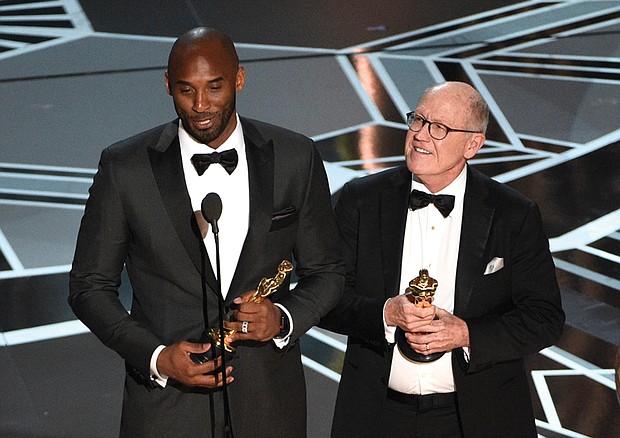 Retired NBA star Kobe Bryant, left, and Disney animator Glen Keane accept Oscars for best animated short for “Dear Basketball” at Sunday’s awards show. Social media blew up, citing an irony in Mr. Bryant’s winning an award in the #MeToo era calling out sexual harassment in light of the 2003 accusation that he sexually assaulted a Colorado hotel employee. The criminal case was dropped and the civil suit against him was settled out of court.