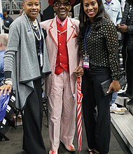 There’s no shortage of celebrities at the CIAA. Middle row from left: Mr. CIAA, Abraham “Ham” Mitchell, dressed in one of his signature outfits, takes a picture with fans during his walk through the arena.