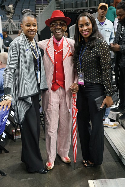 There’s no shortage of celebrities at the CIAA. Middle row from left: Mr. CIAA, Abraham “Ham” Mitchell, dressed in one of his signature outfits, takes a picture with fans during his walk through the arena.