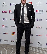 Jamie Carragher has been suspended by Sky Sports for spitting at a football fan and his daughter.