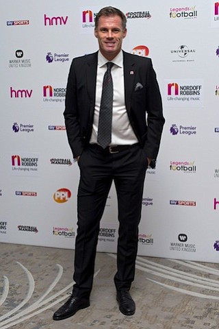 Jamie Carragher has been suspended by Sky Sports for spitting at a football fan and his daughter.