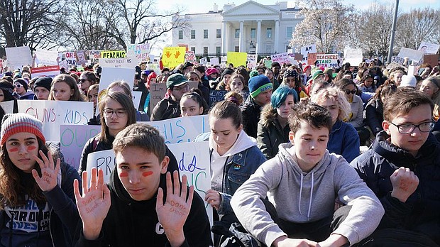 Students sat in silence for 17 minutes with their backs turned to the White House on Wednesday to show support for Marjory Stoneman Douglas High School shooting victims and to protest gun violence.
Source:	Victoria Pickering/Instagram