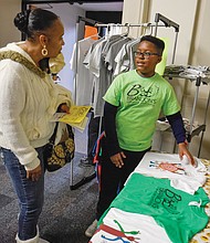 Young entrepreneur //
Move over Jeff Bezos and Elon Musk. The young entrepreneurs, like Brandon Walker of Brandon’s Creative Clothing, are around. Brandon was among a select group of entrepreneurs ages 6 to 17 participating in last Saturday’s inaugural Richmond Children’s Business Fair at the Science Museum of Virginia. The event, sponsored by Acton Academy and Acton School of Business, helped youngsters develop a product or service, create a brand, build a marketing strategy and then open for customers at a one-day marketplace. Above, Brandon talks about his creations with potential customer Verona Williams.