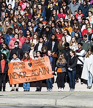 Hundreds of students at the Maggie L. Walker Governor’s School in Richmond participate in an emotional tribute to the 17 people slain at Marjory Stoneman Douglas High School in Parkland, Fla., during Wednesday’s national student walkout. 
